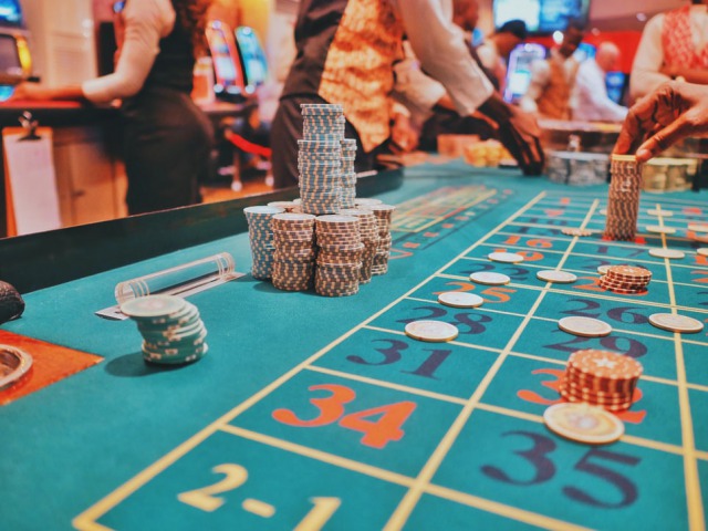 betting-casino-coins-on-the-roulette-game-table